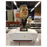 Bill Clinton statue and hp deskjet printer. Bill Clinton statue and hp deskjet printer.