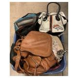 Bin of assorted fashion purses. Bin of assorted fashion purses.