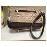 Coach brown clutch purse , zip closures