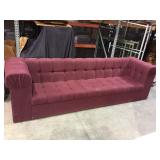 10 foot Red sofa previously belonging to Julian