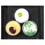 3- ramekins of gemstones, 1- ruby, 2- green