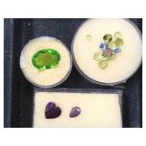 3- ramekins of gemstones, purple, green , blue