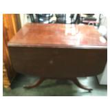 Wooden 3 pedestal drop leaf table on casters