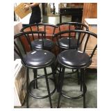 4 Black swiveling bar stools