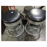 Metal bar stools with black cushions