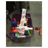 Tub of Super Soaker water toys