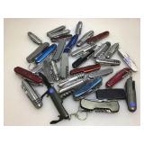 Collection of multi tool knives. Some business