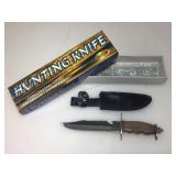 NIB hunting knife.