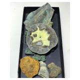 Collection of raw and cut stone specimens