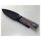 New Dice handled fixed blade knife with sheath.