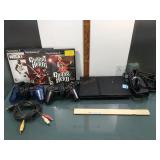 PS2 w/games, 2 controllers, cords, power on but