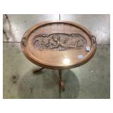 Claw foot oval coffee table, top carved with