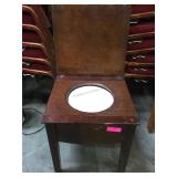 Lift seat potty with porcelain insert , mixed