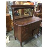 Antique oak claw foot buffet with beveled mirror