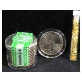 13 never circulated Washington quarters  & a tube