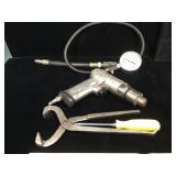 SnapOn tools, pressure gauge, air driver, wheel