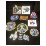 Group of NASA pins and patches