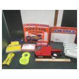 Box of price tags and pricing gun by