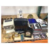 Lot of clocks and cds incl. Howard Miller desk