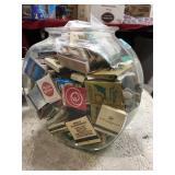Glass bowl filled with matchbooks