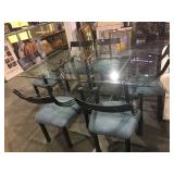 Metal based glass top dining table with 6