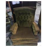 Brown rocking padded armchair