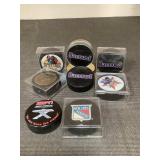 8 hockey pucks no autographs