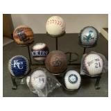9 baseballs with display