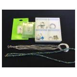 Assortment of fashion jewelry, necklaces, body