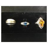3- Sterling rings m 1- blue gem, 1- orange gem