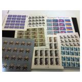 Assortment of unused stamps, $50.40 face value