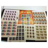 Assortment of unused stamps, $54.30 face value