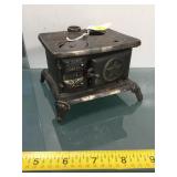 Antique toy cast iron stove, missing one stove