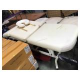Adjustable massage table with headrest