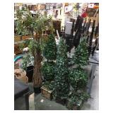 Lot of faux plants in stands