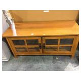 Wooden short stand table with glass doors