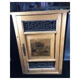 Vintage small wooden cabinet with decorated front