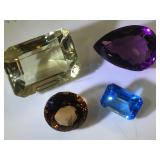 Various sizes & colors of gemstones, possibly