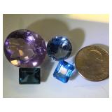 Various sizes & colors of gemstones, possibly