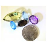 Various sizes & colors of gemstones, possibly