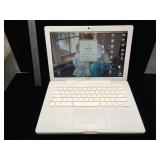 Apple MacBook laptop with charger - powers on