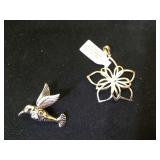 Sterling bird & a Sterling flower pendants.
