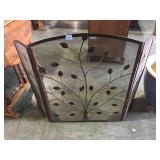 Metal leaf patterned fireplace screen