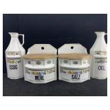 Vtg 4 pc canister set, floral design w/gold trim,