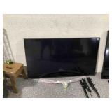 Lg Flatscreen 56in Tv With Wall Mount In Stand