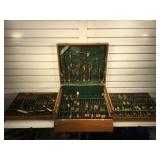 Large set of brass flatware in wooden box marked