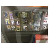 Stack of sports cards in pages