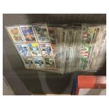 Stack of sports cards in pages