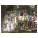 Stack of sports cards in pages