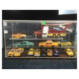 Plexi display with vintage die-cast cars